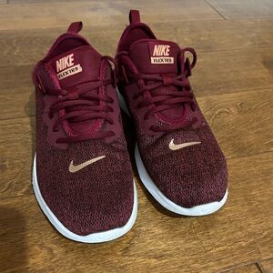 Women’s burgundy Nike running shoes